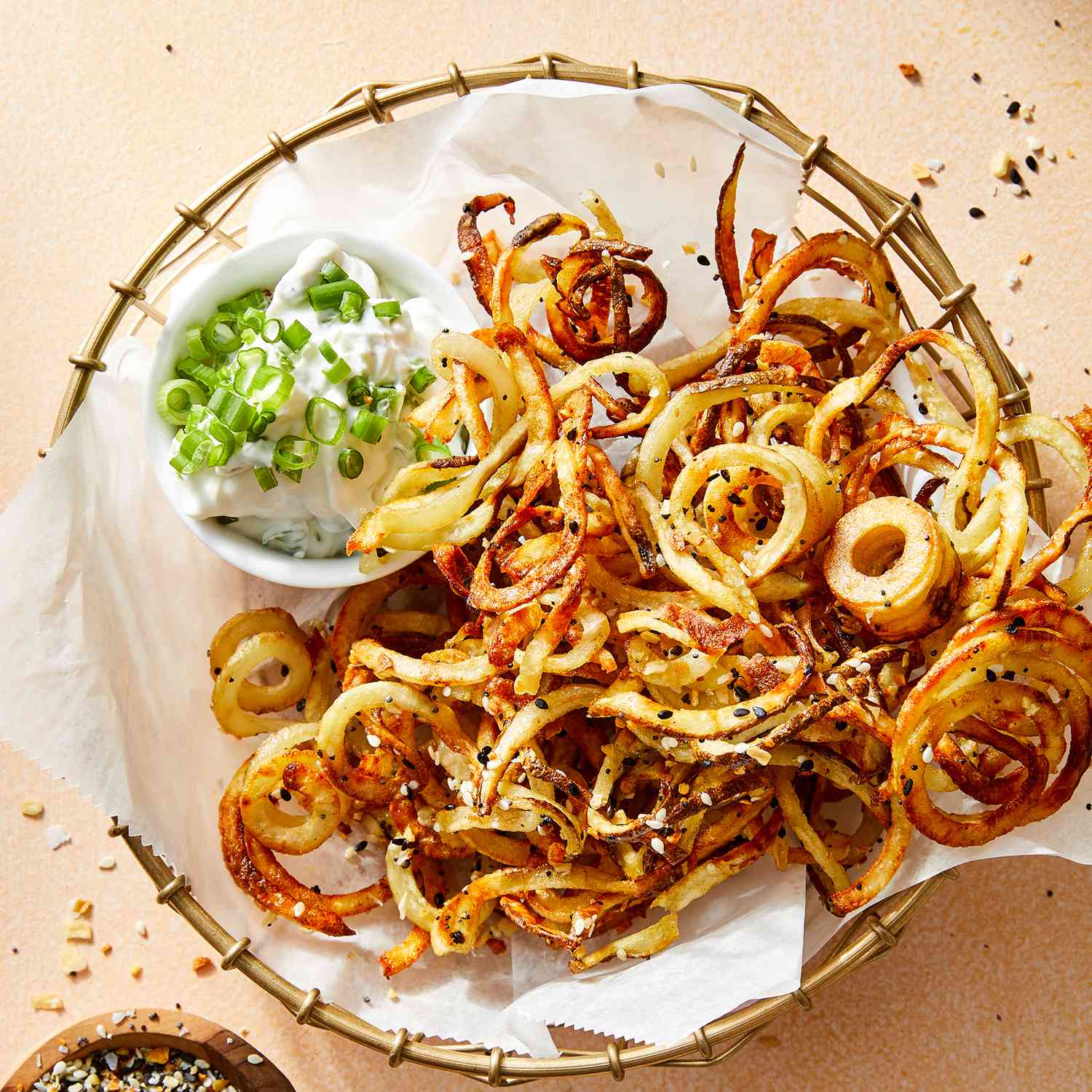 a recipe photo of the Air-Fryer Everything Bagel Curly Fries with Scallion-Yogurt Dip