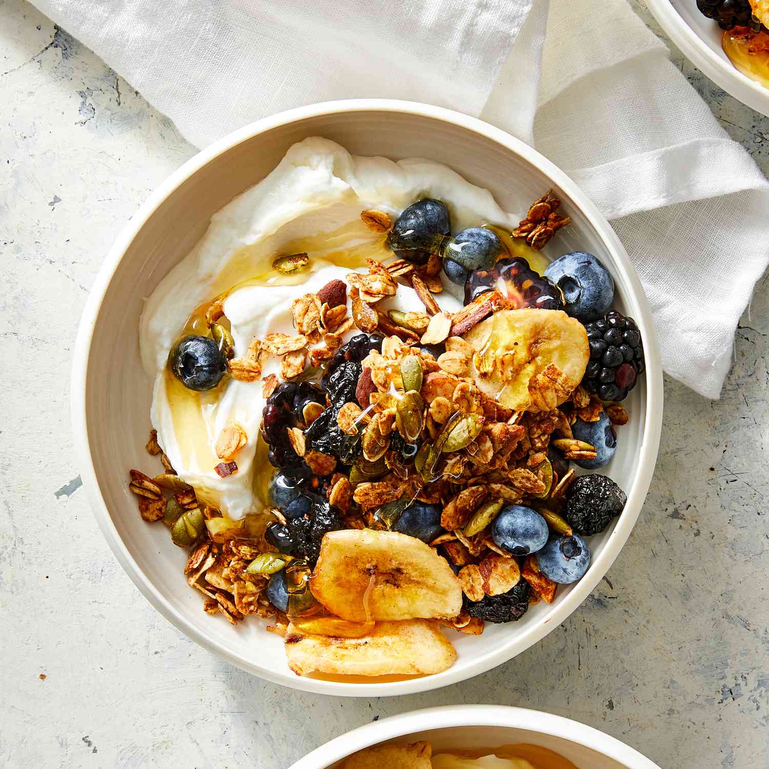 a recipe photo of the Air-Fryer Honey Granola with Banana Chips & Cherries