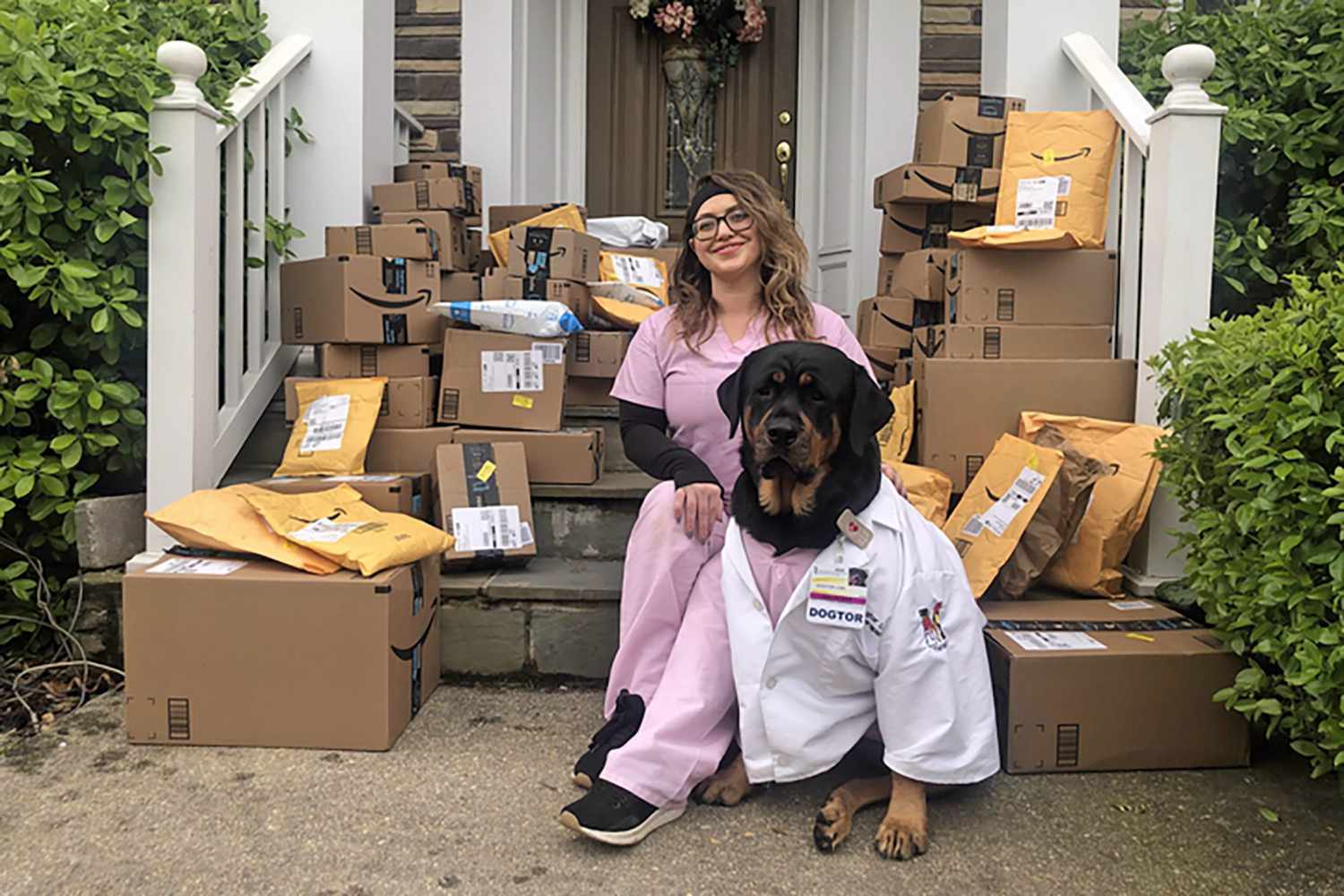 Dogtor Loki on the front porch filled with mailing packages