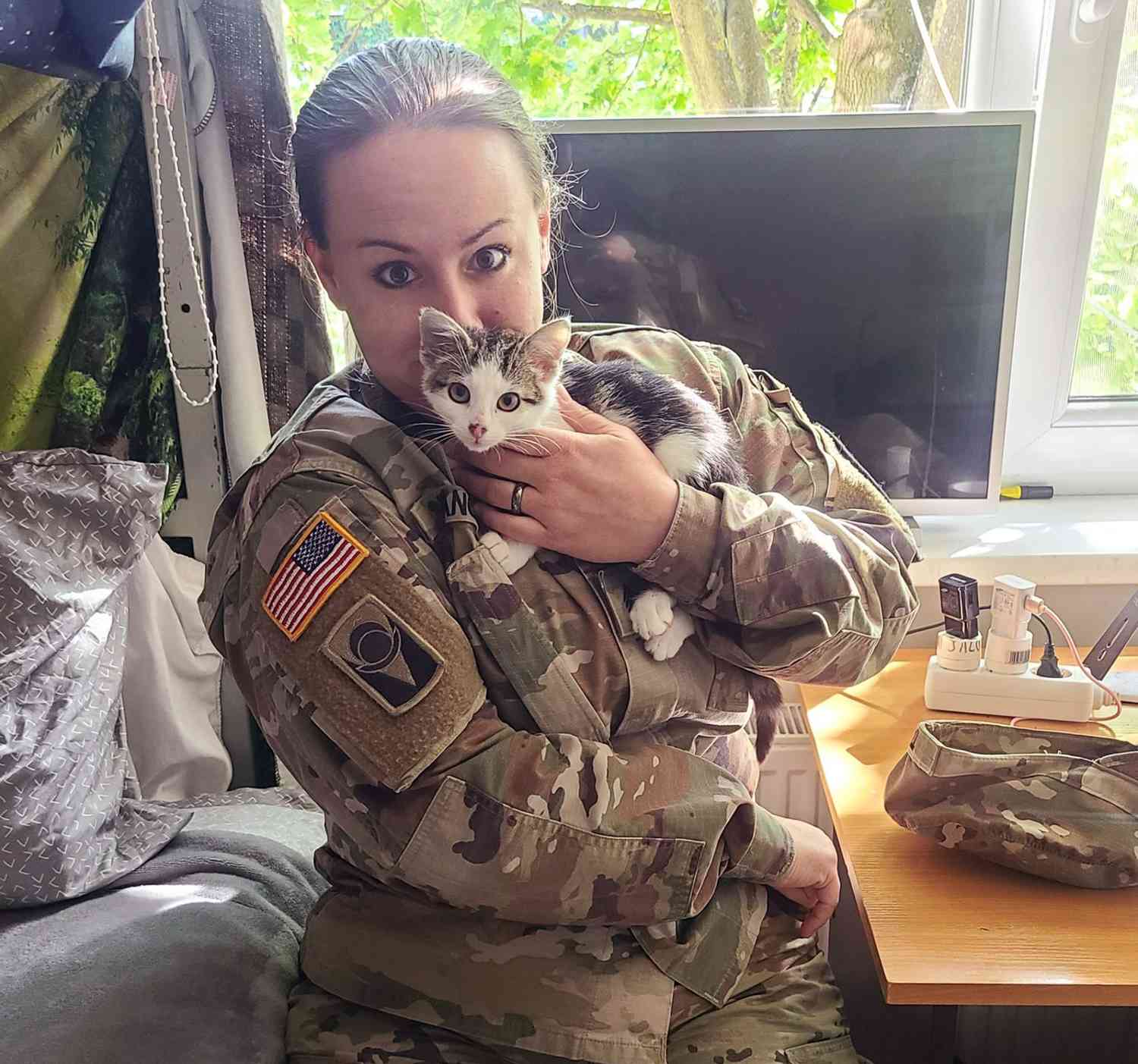 Kitty, Cathulhu, held by Sgt. Arielle for the SPCA International Military Kitty rescue
