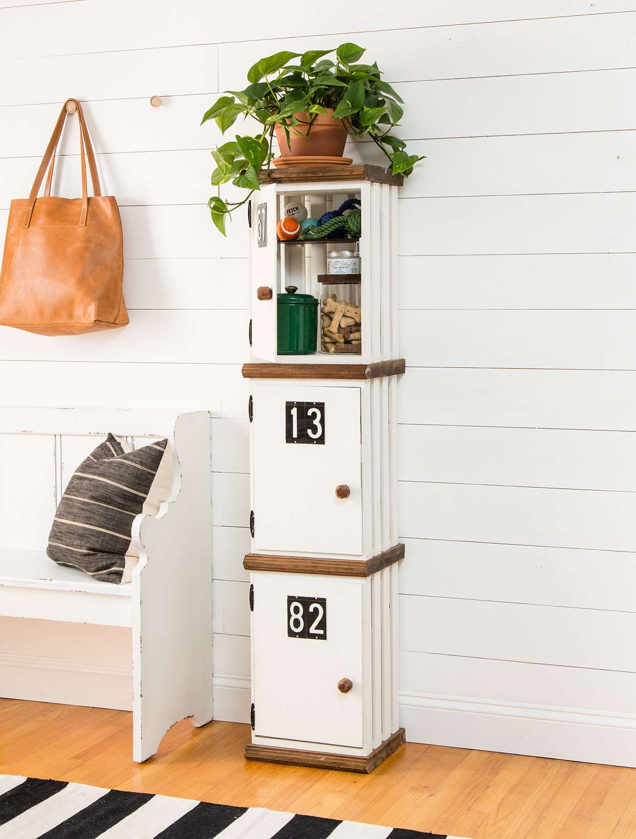 cabinet storage created from repurposed wooden crates and painted white