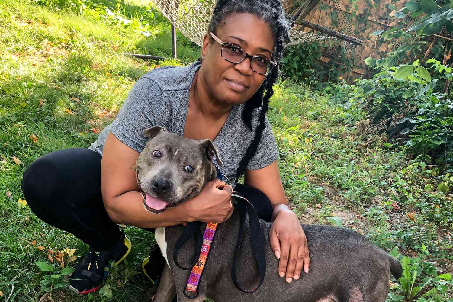 grieving wife hugging adopted dog