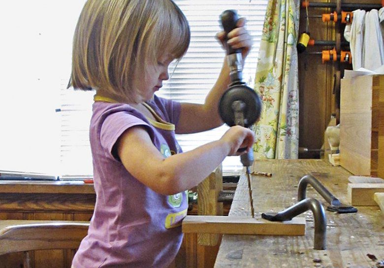 Children learning woodworking