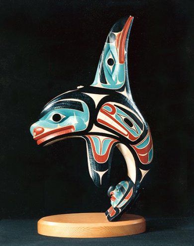 A stylized carving of a killer whale.