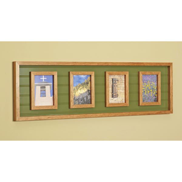 Large picture frame with four smaller picture frames inserted in it.
