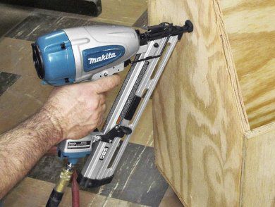 Using a Makita on side of wooden box.