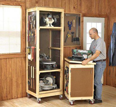 A large tall storage cabinet on wheels, and a mobile cabinet for bench top tools on wheels.