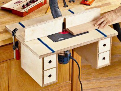 Router table with drawer storage under it.