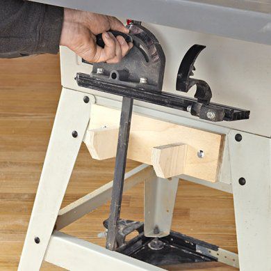 Miter gauge with attached fence on tablesaw.