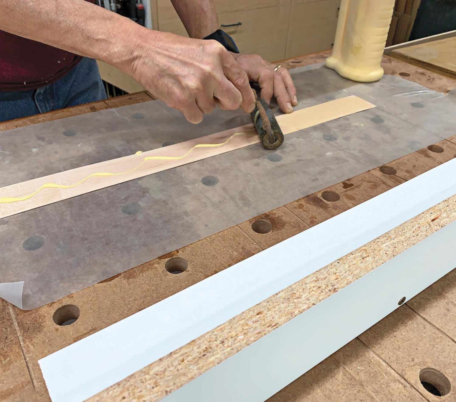 Photo of wax paper under strip while gluing