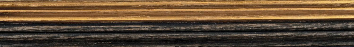 Photo of gilt cream and black wax applied to two sections of wood