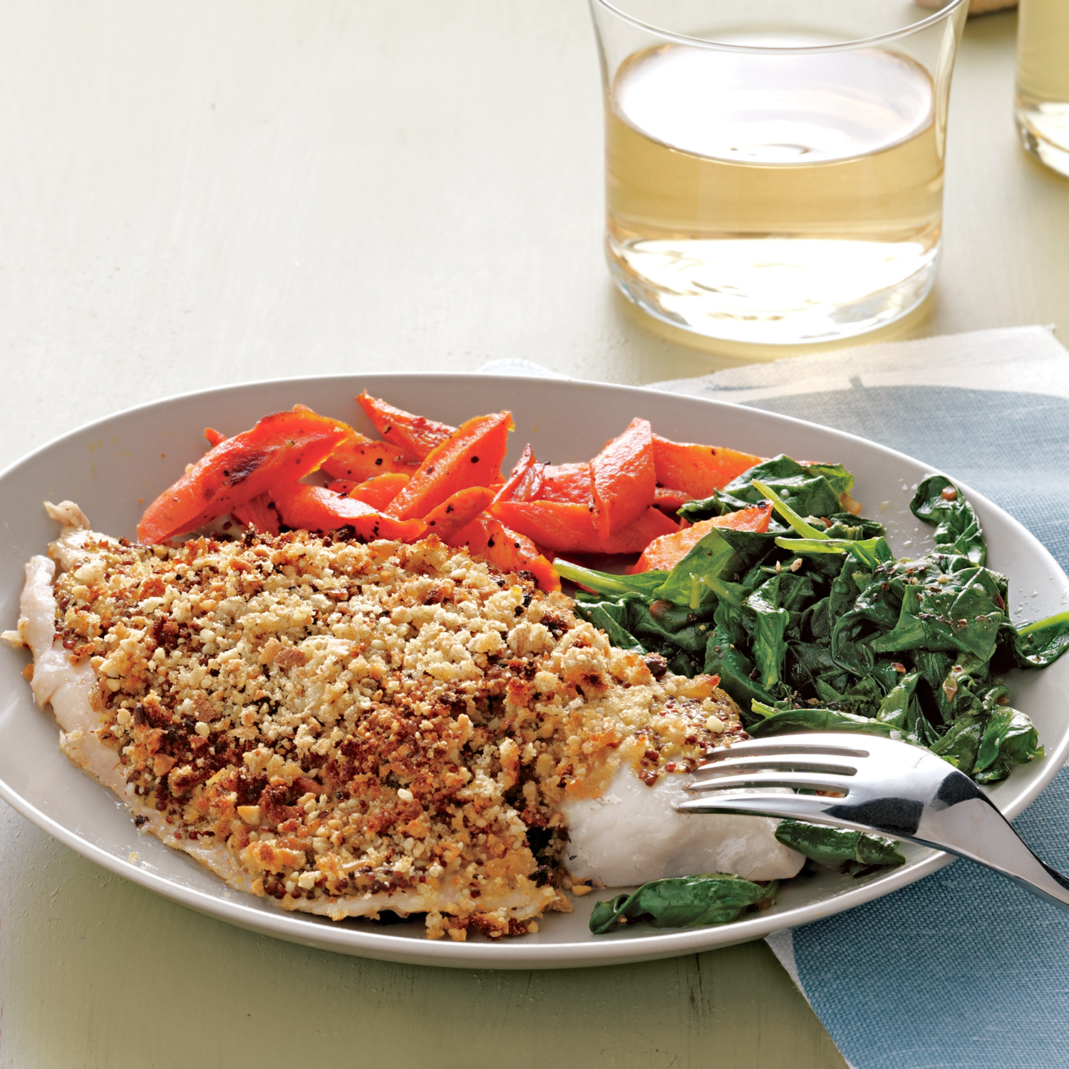 Nut-Crusted Tilapia with Spinach and Roasted Carrots