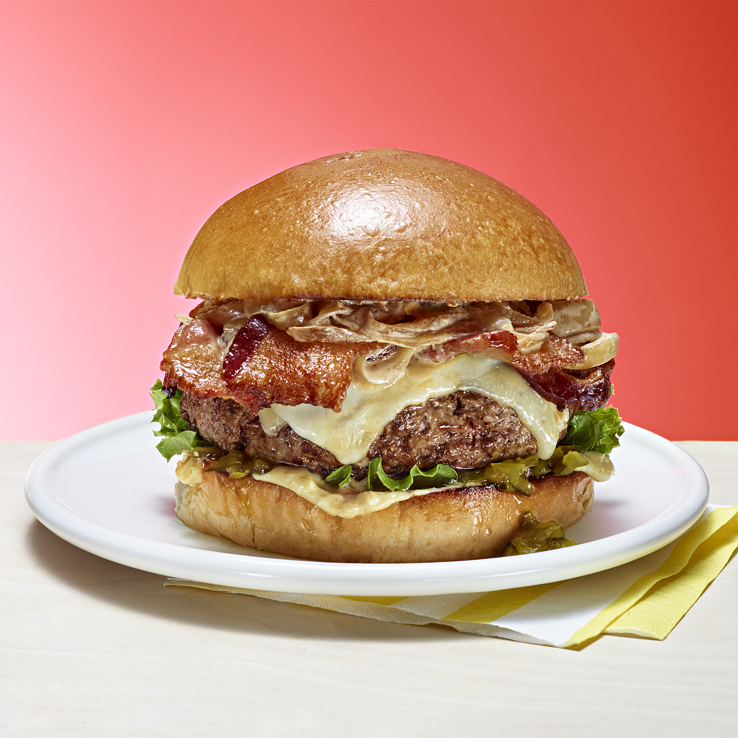 two-cheese bacon burger with onion sauce