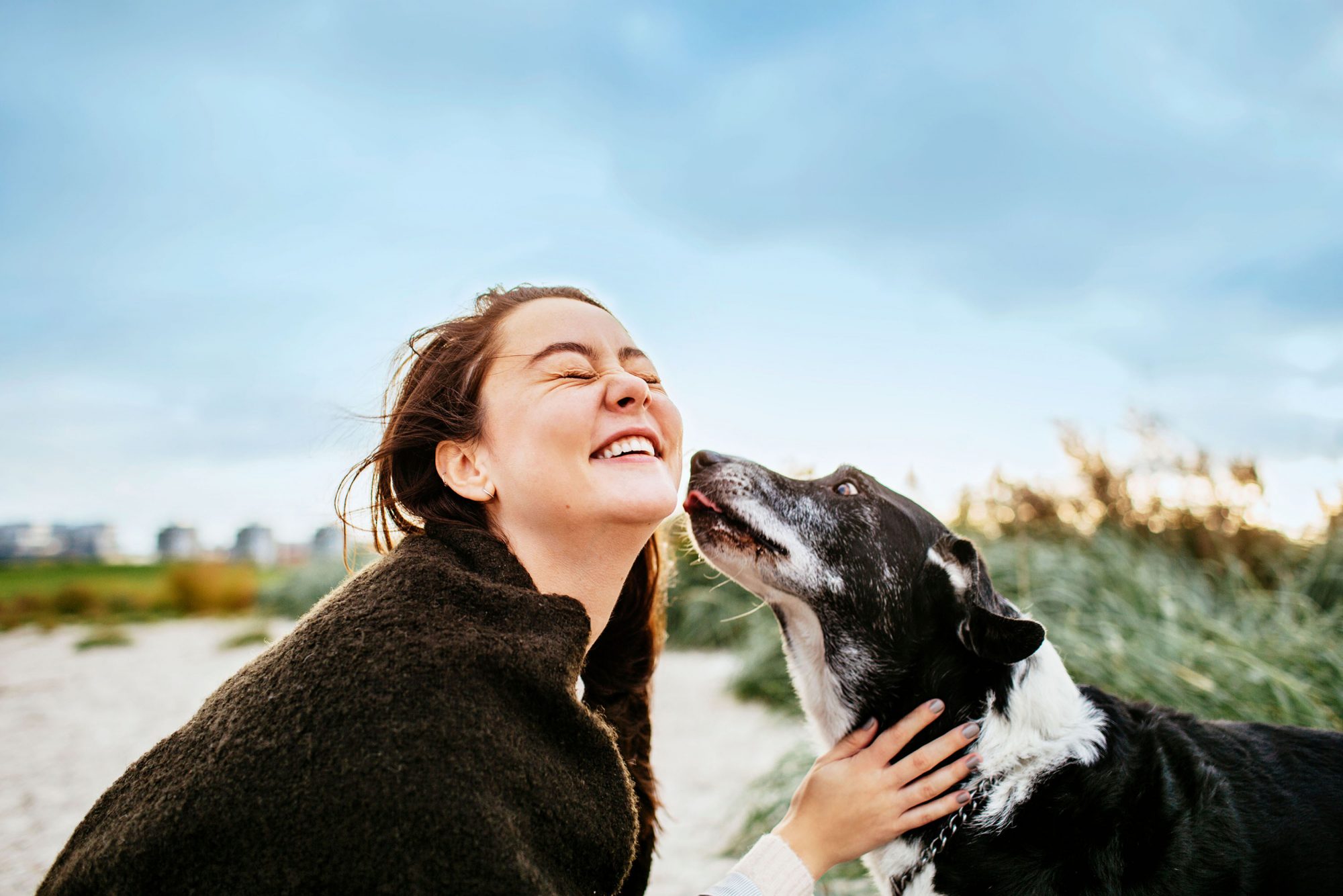 girl smiling with dog