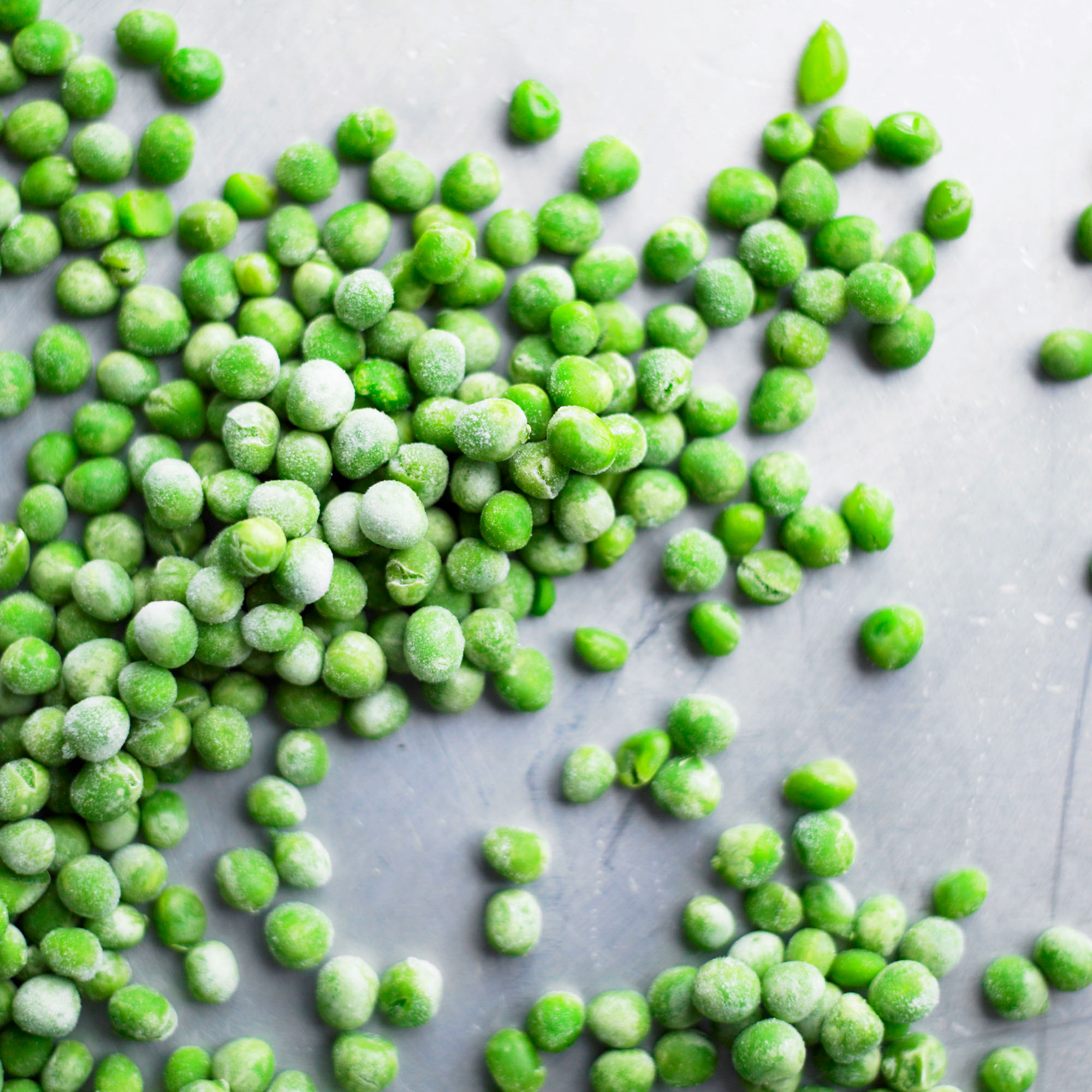 frozen peas on gray surface