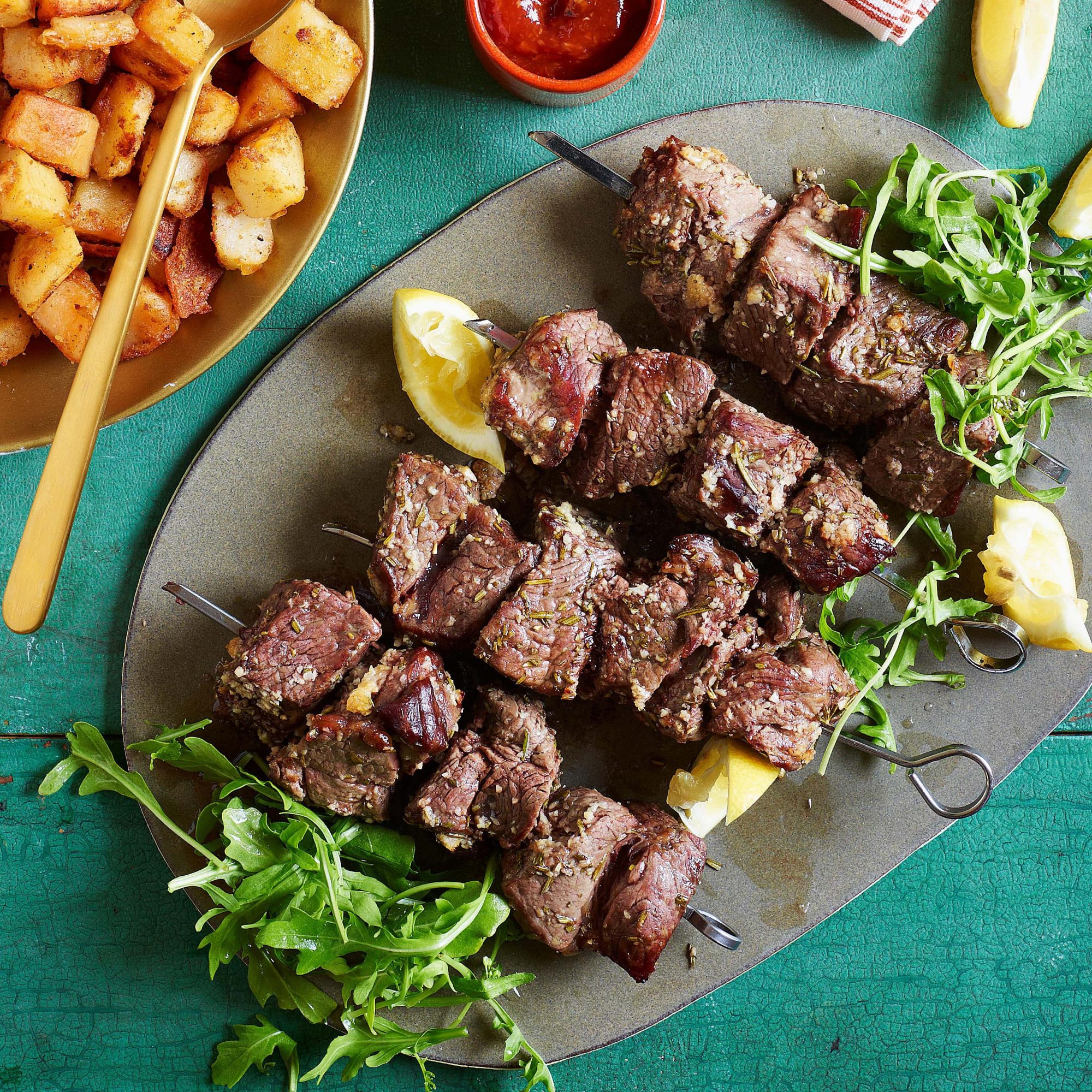 Garlicky Beef Skewers with Potato Hash & Spiked Ketchup
