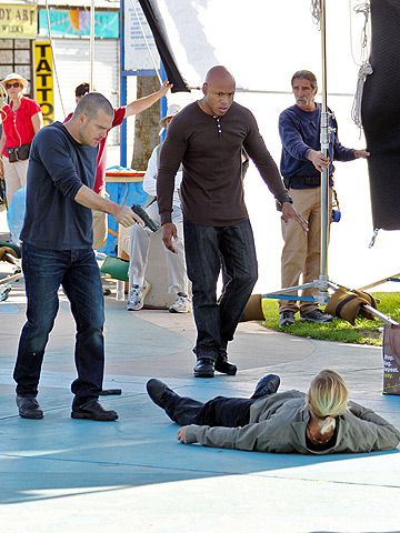 Chris O'Donnell and LL Cool J in the heat of the moment on the set of NCIS: Los Angeles at the Venice boardwalk in L.A.