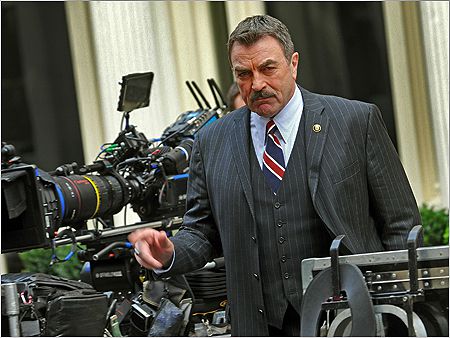 Tom Selleck 's looking all red, white, and blue while filming on the streets of Manhattan.