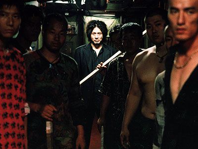 Choi Min-Sik, Oldboy | Revenge is a dish that's best served cold...unlike octopus, which can be downed alive. Oh Dae-su (Choi Min-sik) has been imprisoned for 15 years. He