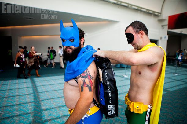 San Diego Comic-Con 2013 | Robin helps Batman with his outfit.