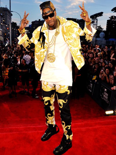 Dressing like he just raided Gianni Versace's closet is the rapper's style m.o. But wearing the same pants as VMA red carpet co-host Grimes was