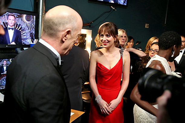 Best Supporting Actor winner J.K. Simmons and "Fifty Shades of Grey" star Dakota Johnson backstage