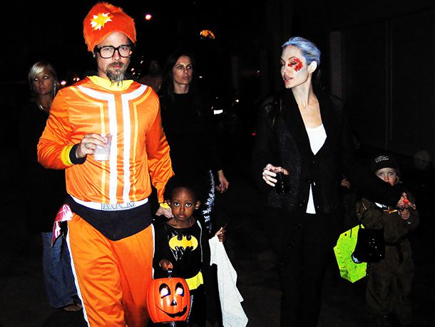 Brad Pitt, Angelina Jolie | Swapping couture for costumes, the proud parents escorted their brood around Los Angeles for trick-or-treating fun. Pitt is clearly fully committed to his DJ Lance