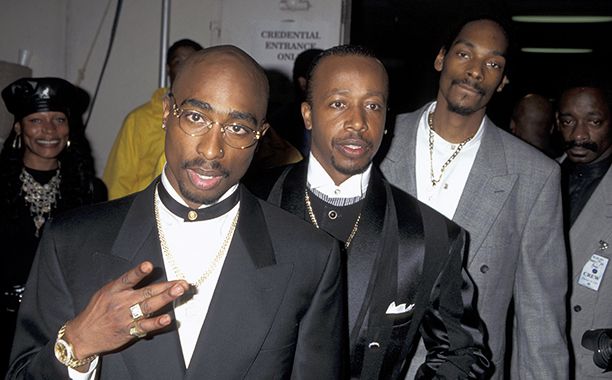 Tupac Shakur with M.C. Hammer and Snoop Dogg at the 23rd Annual American Music Awards on January 29, 1996