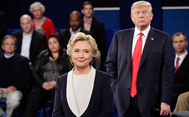 GALLERY: Biggest TV Stories of 2016: GettyImages-613701970.jpg Hillary Clinton (L) and Republican presidential nominee Donald Trump listen during the town hall debate at Washington University on October 9, 2016 in St Louis, Missouri.