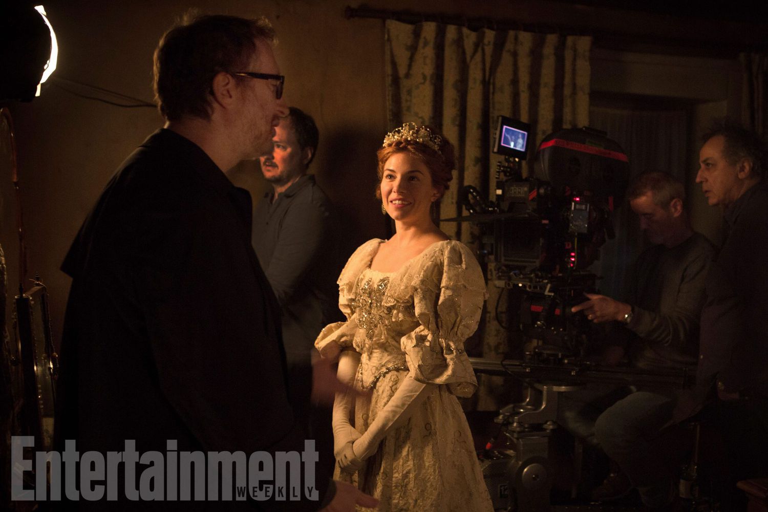 Director James Gray (left) discusses a scene with actress Sienna Miller