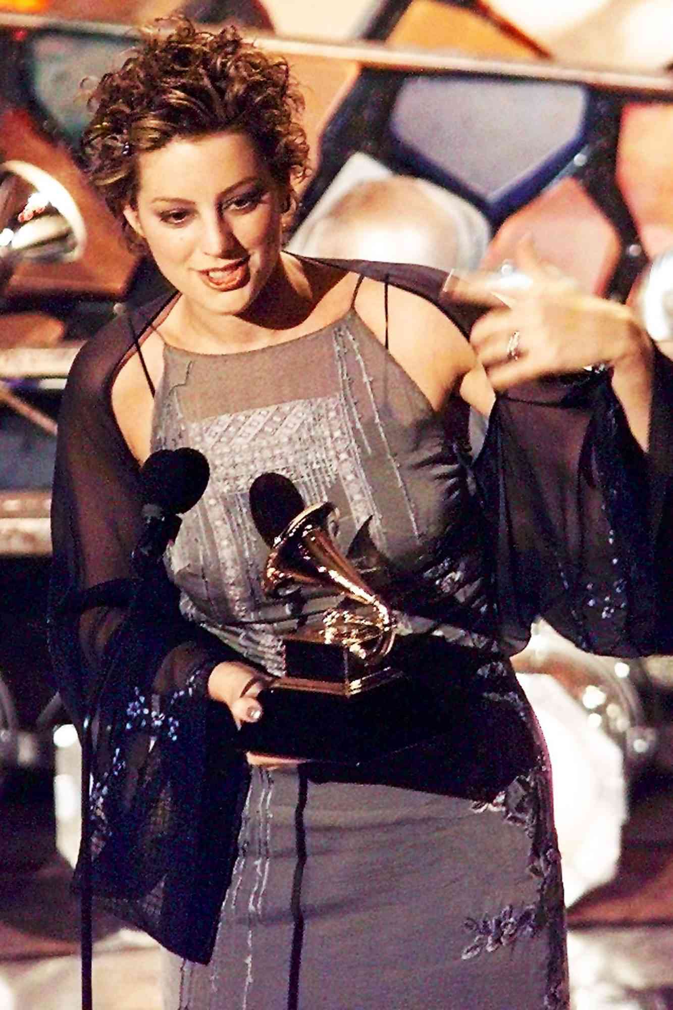 Sarah McLachlan holds up her Grammy Award for Best