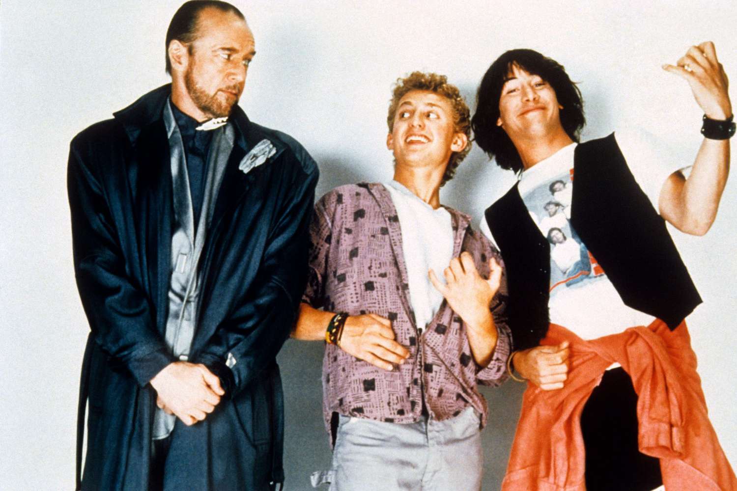 BILL AND TED'S EXCELLENT ADVENTURE, from left: George Carlin, Alex Winter, Keanu Reeves, 1989, © Ori