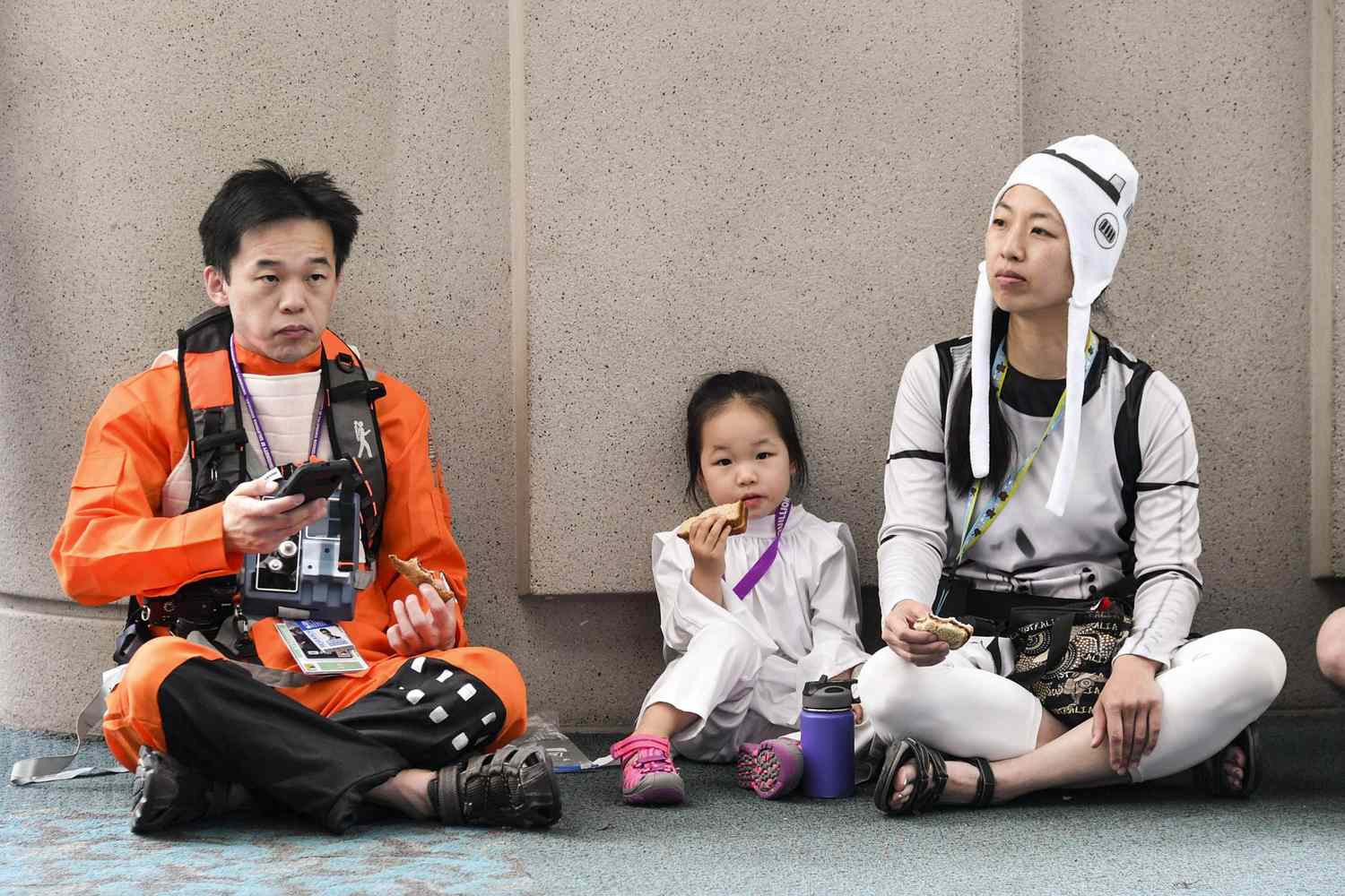 A family of Star Wars&nbsp;cosplayers grabs a snack during the festivities