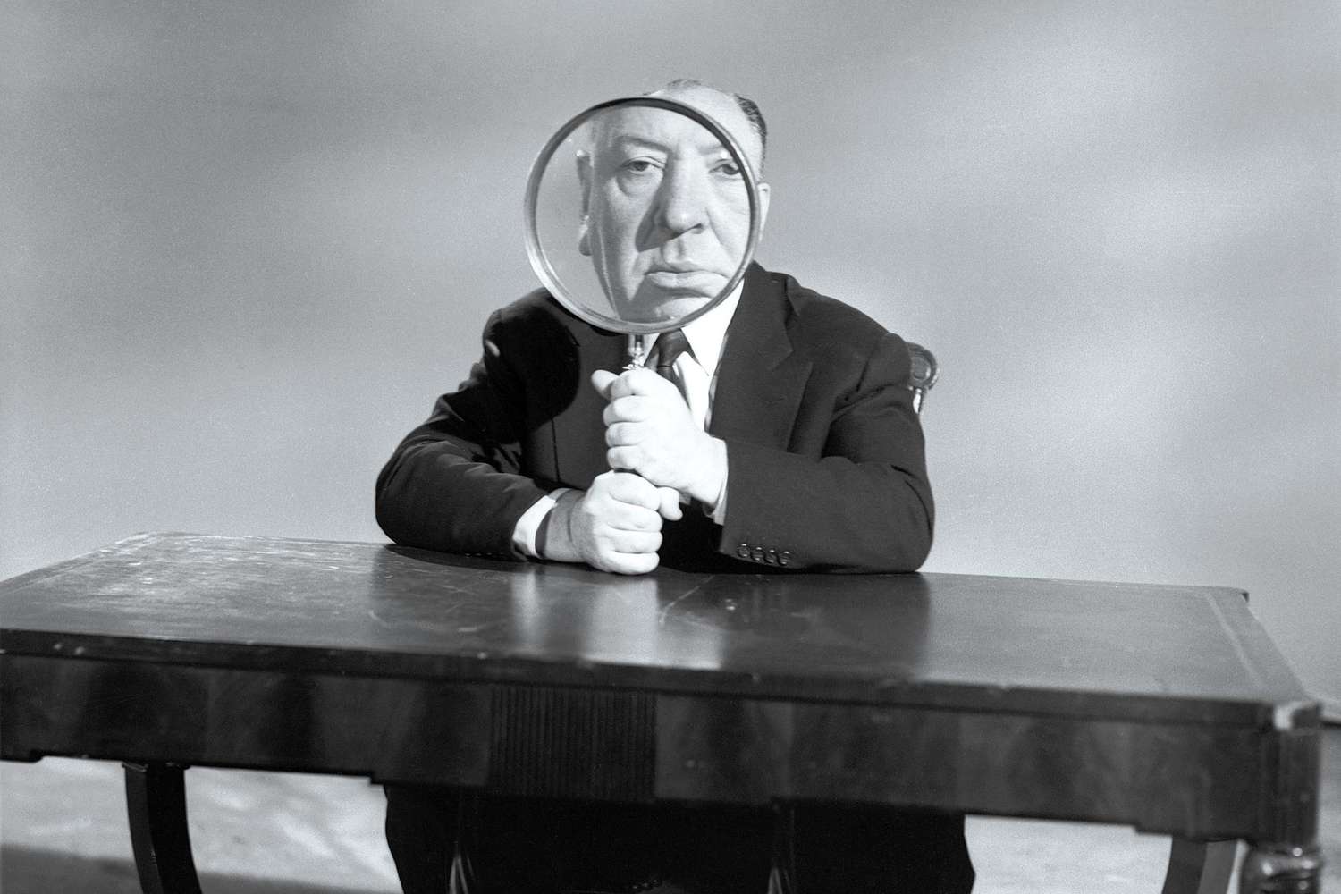 Alfred Hitchcock Holding Magnifying Glass
