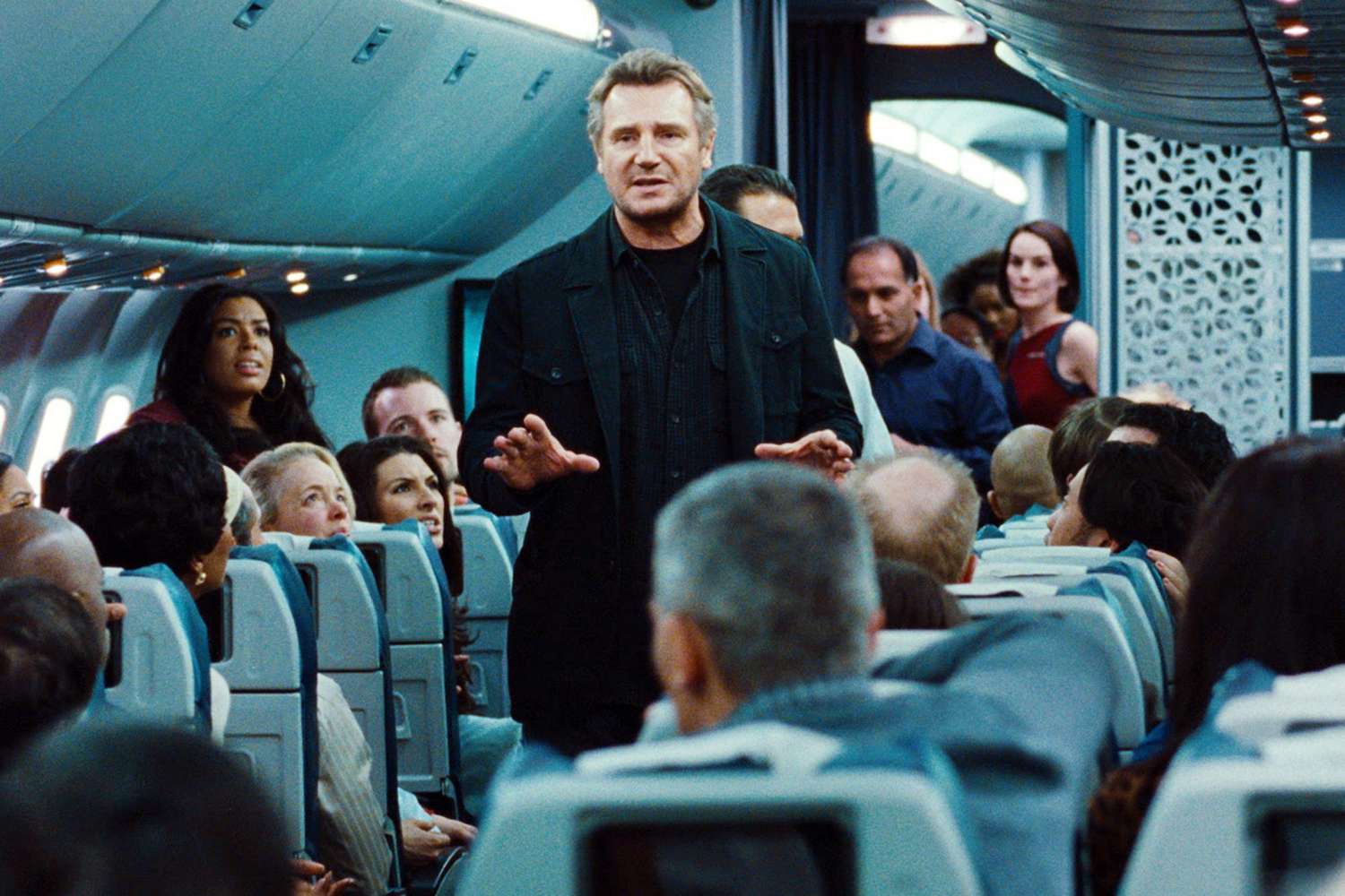 NON-STOP, Liam Neeson (left of center), 2014. &copy;Universal/courtesy Everett Collection