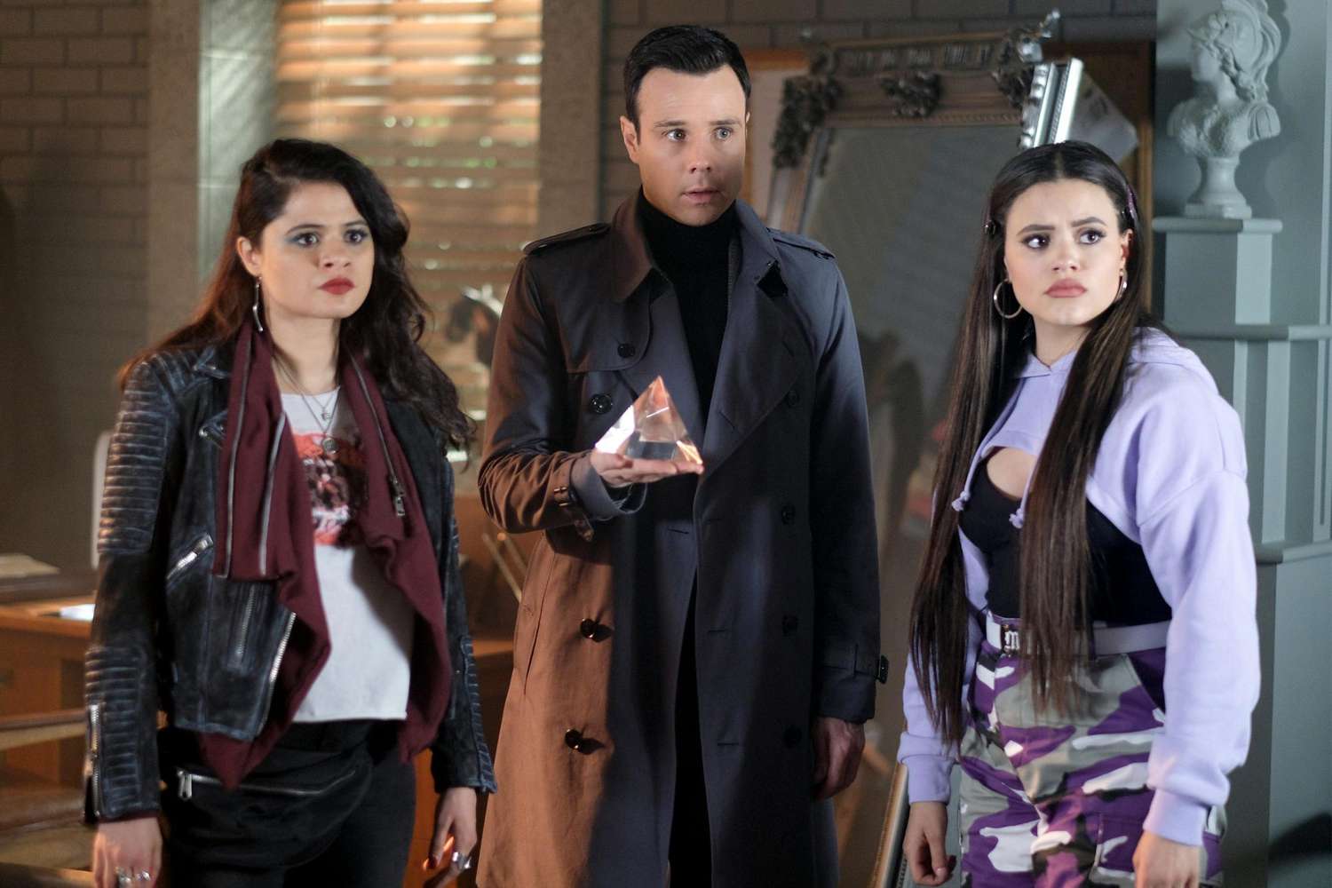 Charmed -- "The Source Awakens" -- Image Number: CMD122b_0300.jpg -- Pictured (L-R): Melonie Diaz as Mel, Rupert Evans as Harry and Sarah Jeffery as Maggie -- Photo: Robert Falconer/The CW -- &Atilde;&Acirc;&copy; 2019 The CW Network, LLC. All rights reserved.
