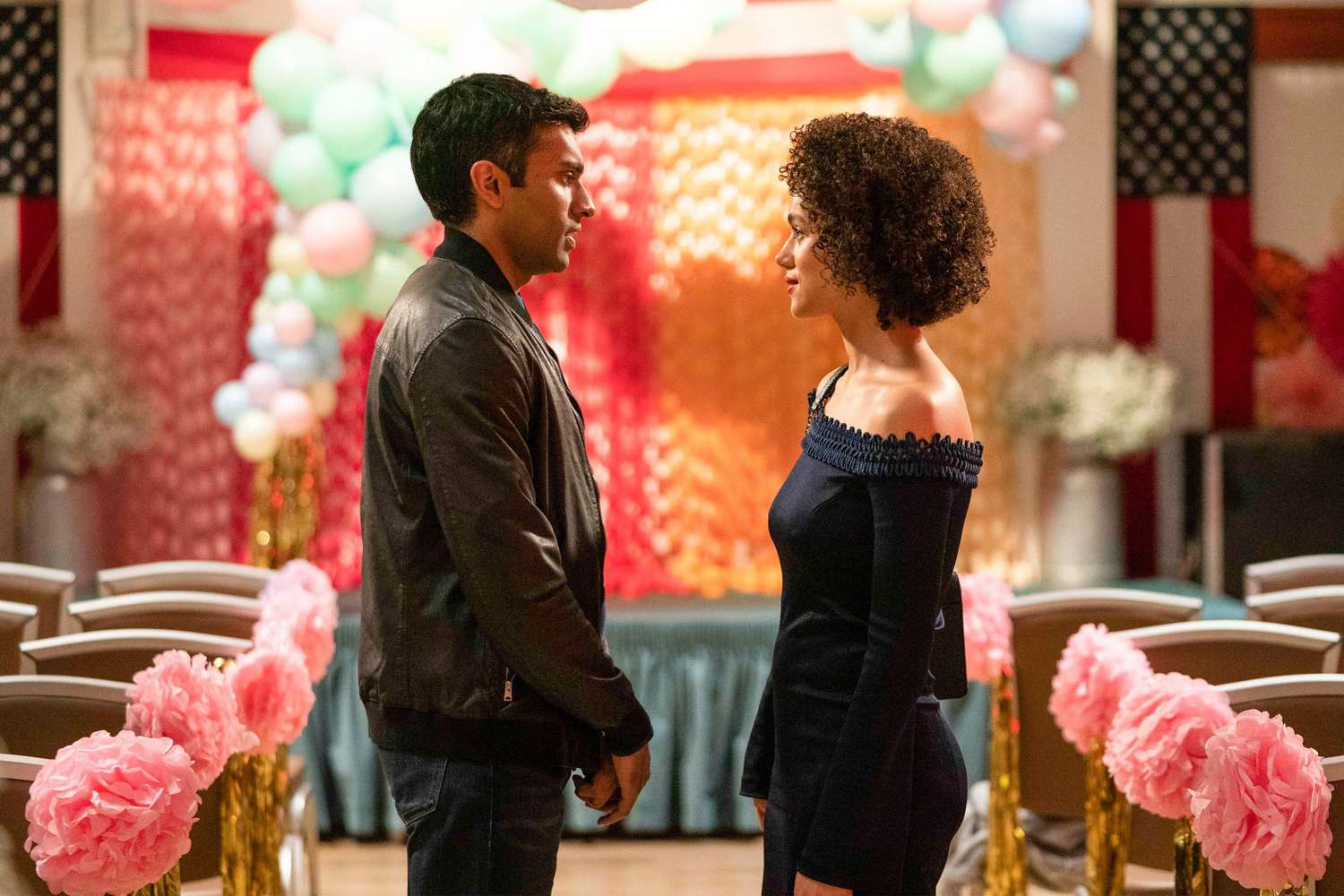 Four Weddings and A Funeral - "New Jersey" - Episode 110 -- A year after Maya and Ainsley's blowup, the fractured friend group hopes that a wedding may be the perfect occasion for a reunion. Kash (Nikesh Patel) and Maya (Nathalie Emmanuel), shown. (Photo by: Robert Viglasky/Hulu)