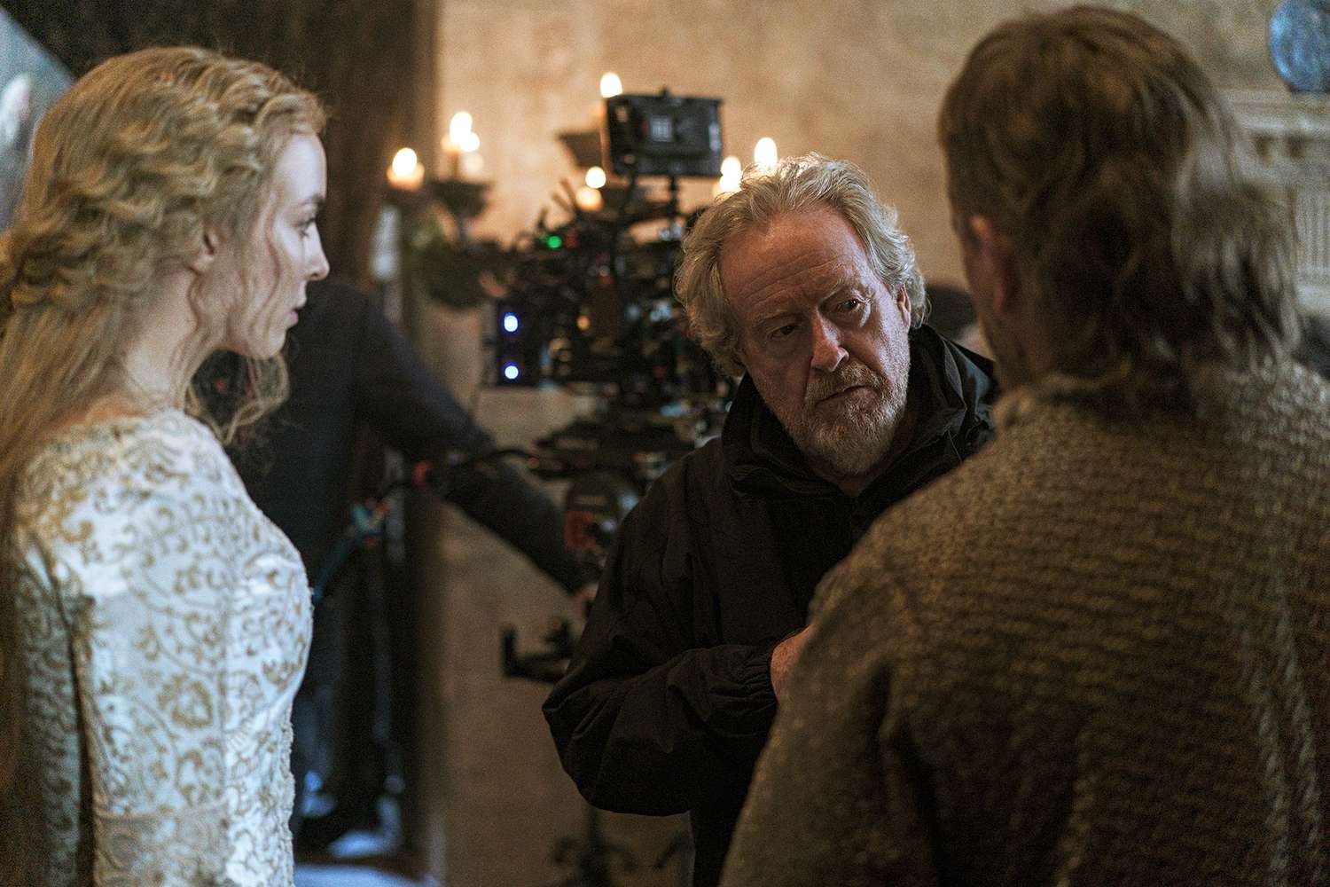 Jodie Comer, director Ridley Scott, and Matt Damon behind the scenes of 20th Century Studios' THE LAST DUEL.