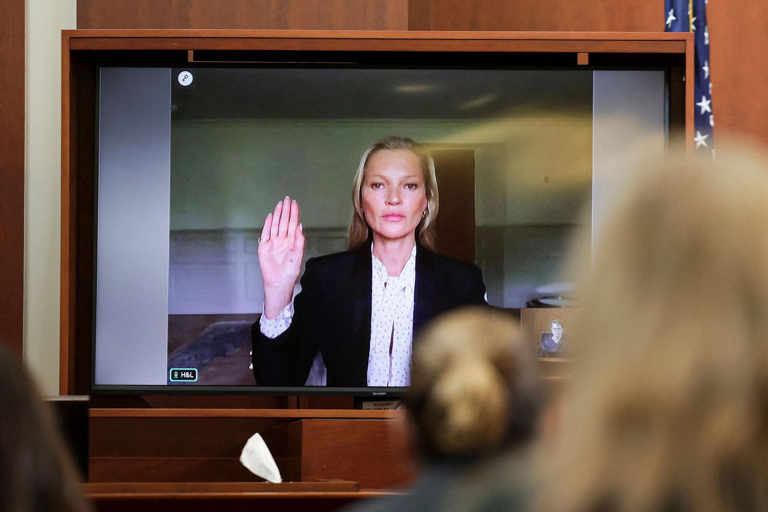 Model Kate Moss is sworn in via video link at the Fairfax County Circuit Courthouse in Fairfax, Virginia, on May 25, 2022.
