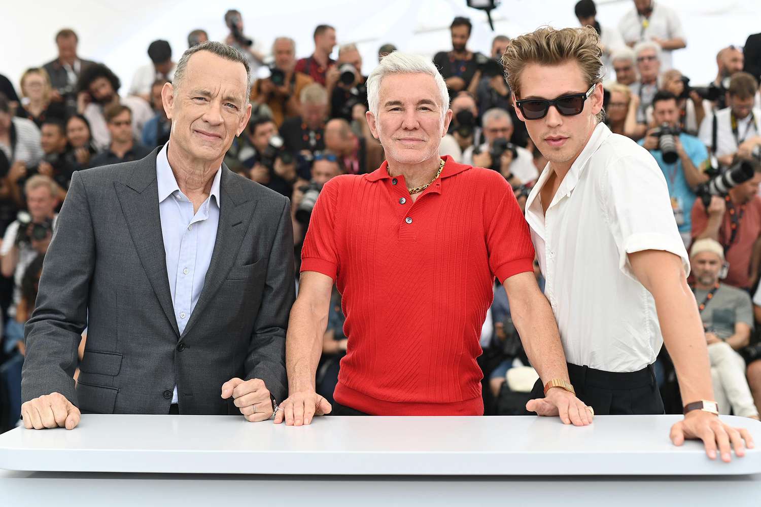 Tom Hanks, Director Baz Luhrmann and Austin Butler attend the photocall for "Elvis" during the 75th annual Cannes film festival at Palais des Festivals on May 26, 2022 in Cannes, France.