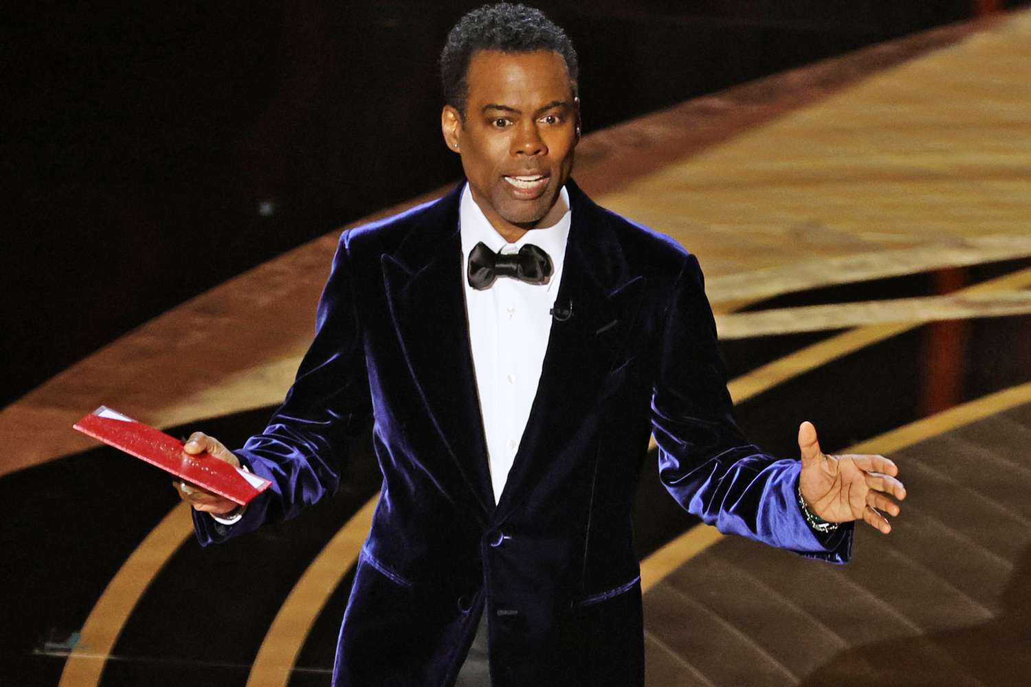HOLLYWOOD, CALIFORNIA - MARCH 27: Chris Rock speaks onstage during the 94th Annual Academy Awards at Dolby Theatre on March 27, 2022 in Hollywood, California. (Photo by Neilson Barnard/Getty Images)