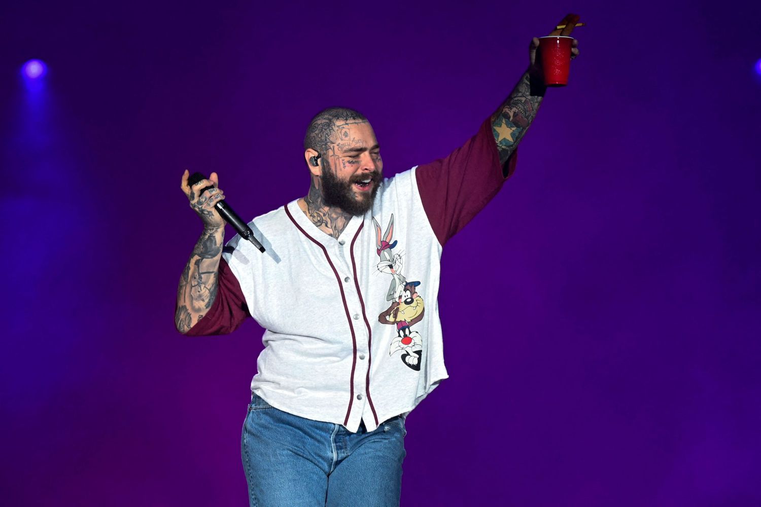 US rapper Post Malone performs on the Main stage of the Rock in Rio music festival at the Olympic Park in Rio de Janeiro, Brazil, on September 4, 2022. - The Rock in Rio megafestival shakes up the city of Rio de Janeiro again starting this Friday after a three-year break due to the Coronavirus pandemic, with names like Justin Bieber, Dua Lipa and Coldplay among its principal attractions. (Photo by MAURO PIMENTEL / AFP) (Photo by MAURO PIMENTEL/AFP via Getty Images)