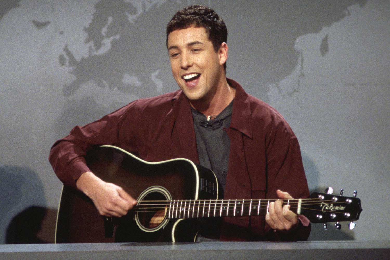 SATURDAY NIGHT LIVE -- Episode 7 -- Air Date 12/03/1994 -- Pictured: Adam Sandler performs 'The Chanukah Song' during "Weekend Update" on December 3, 1994 (Photo by Alan Singer/NBCU Photo Bank/NBCUniversal via Getty Images via Getty Images)