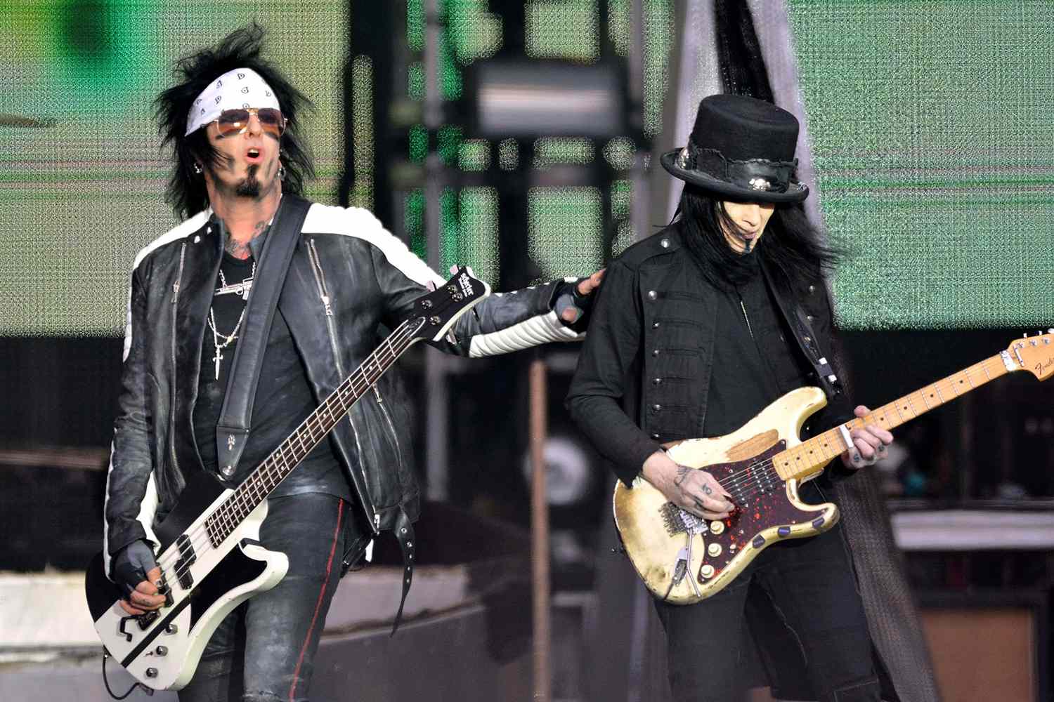 Nikki Sixx and Mick Mars performing live with Motley Crue as part of the Download Festival on June 14, 2015