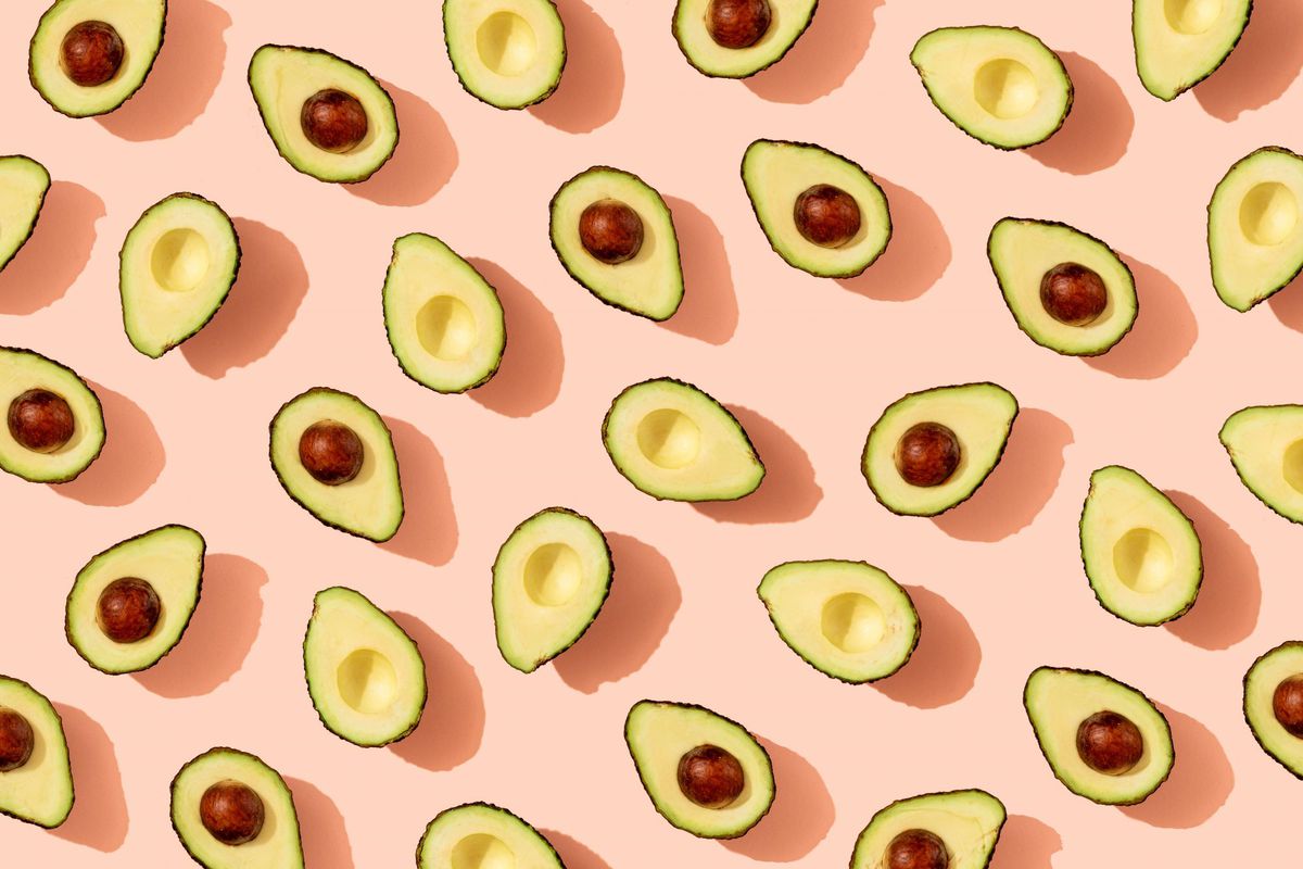Halved Avocados on Pink Background