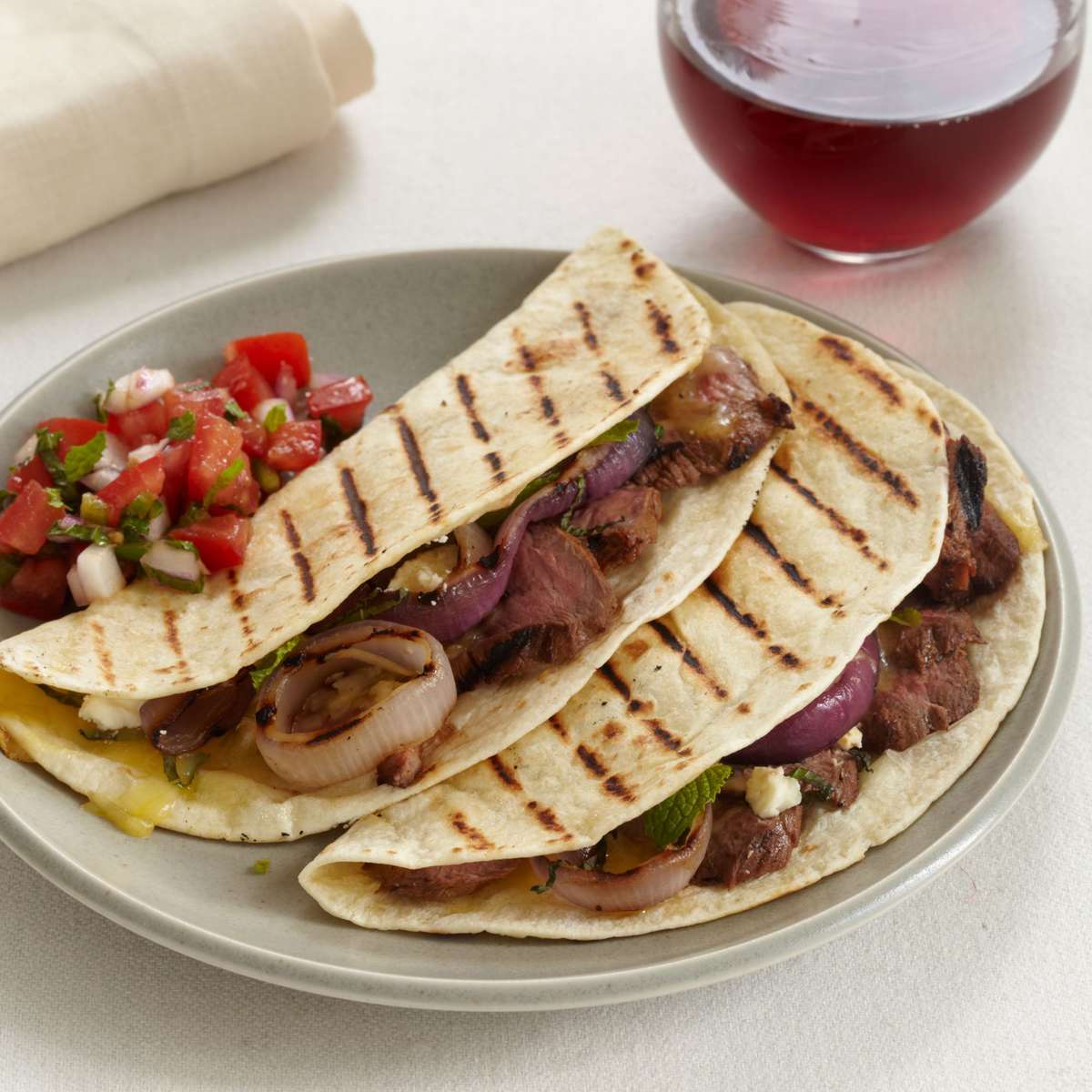 Grilled Lamb and Red Onion Tacos with Tomato-Mint Salsa 