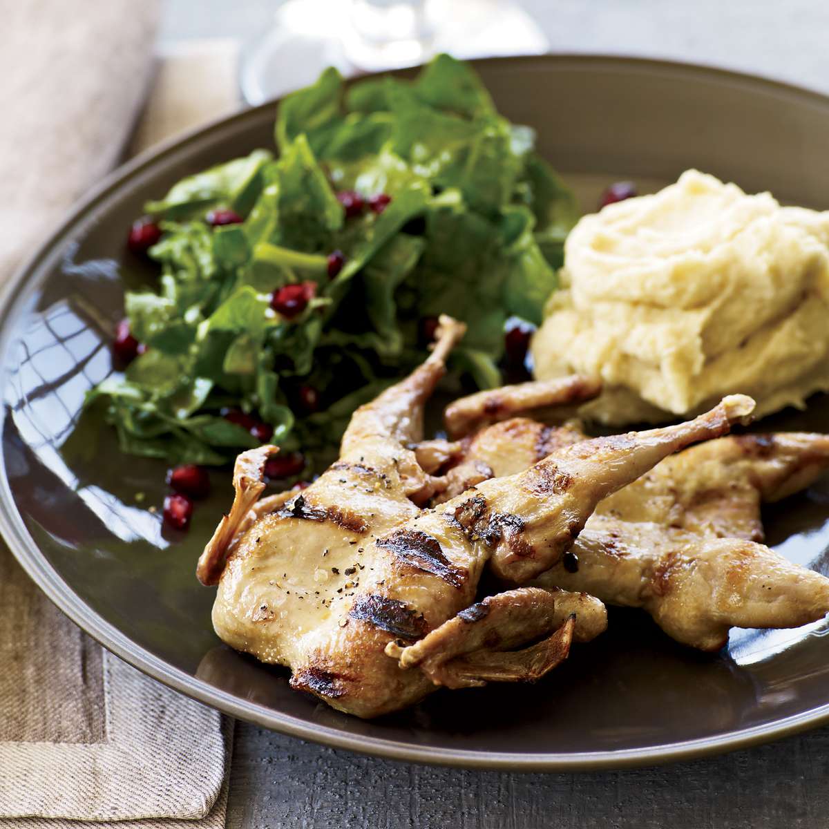 Grilled Quail with Spinach-Pomegranate Salad 