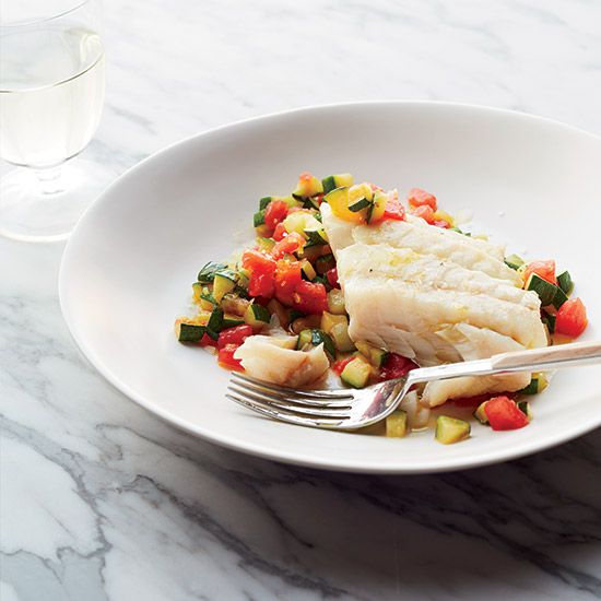 Olive Oil-Poached Hake on Saut&eacute;ed Zucchini with Tomatoes