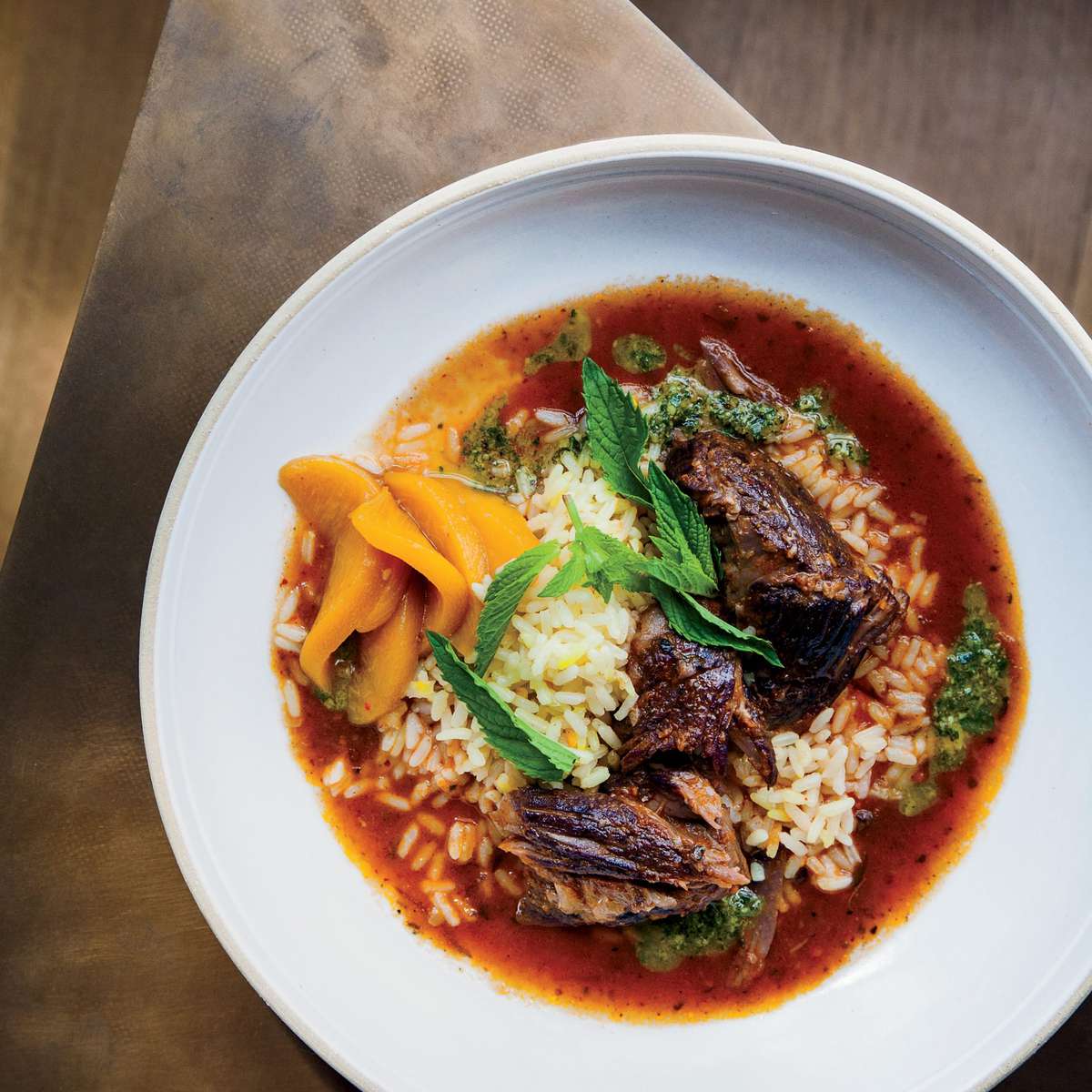 Red Wine-Braised Lamb with Saffron Rice, Mint Pistou and Pickled Peaches 