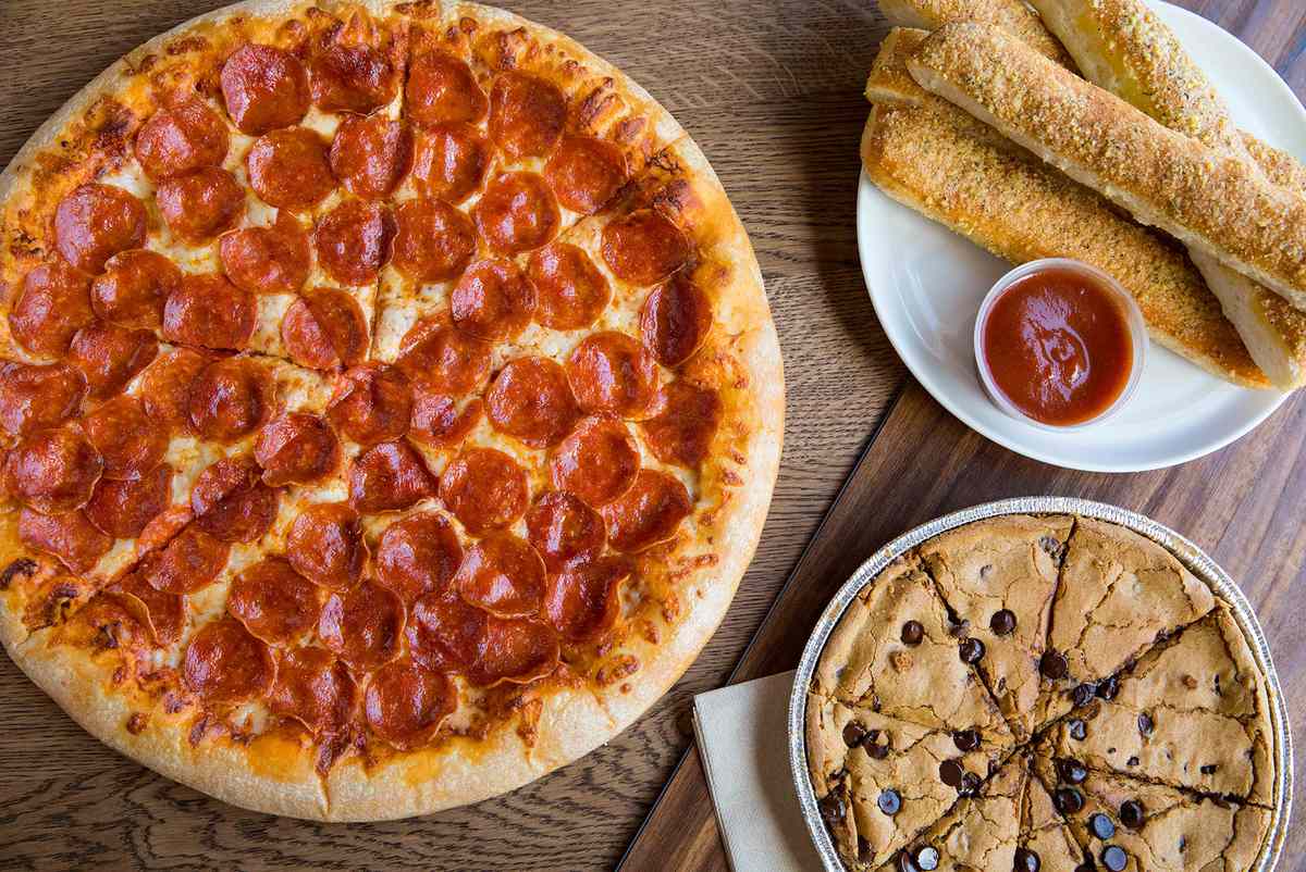 Pizza Hut pizza, breadsticks, and cookie